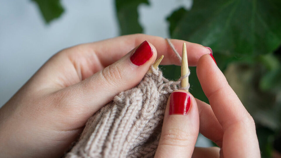 Hands knitting.